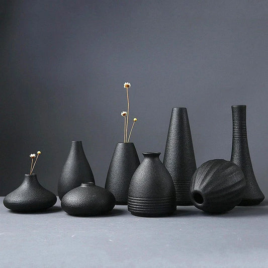 Black Ceramic Vase – Minimalist Japanese-Style Table Décor, This sleek black ceramic vase brings a touch of Japanese-inspired minimalism to any space. Perfect for table and shelf décor, it adds elegance and simplicity, ma